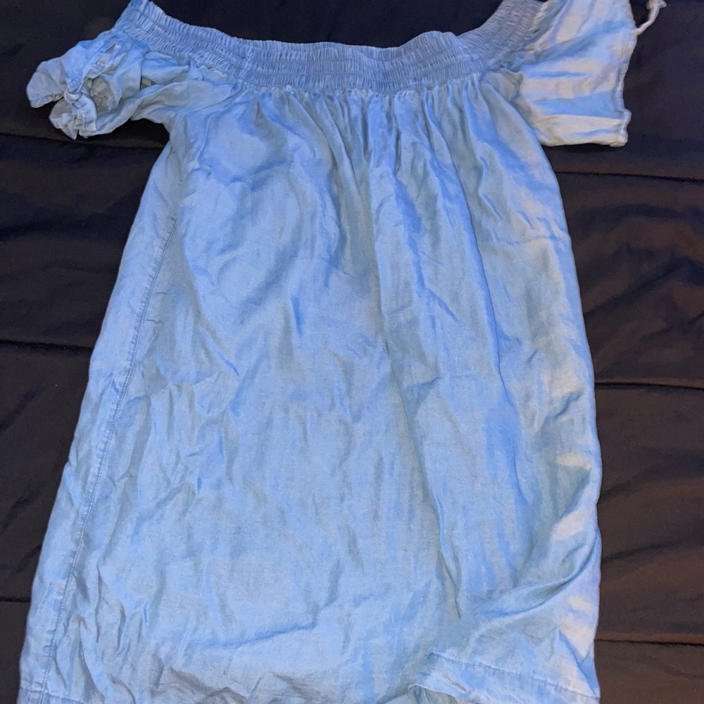 A denim off the shoulder dress.